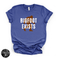 Bigfoot Exists Tee | Funny Cryptid Graphic T-Shirt (WHITE DESIGN)