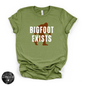 Bigfoot Exists Tee | Funny Cryptid Graphic T-Shirt (WHITE DESIGN)